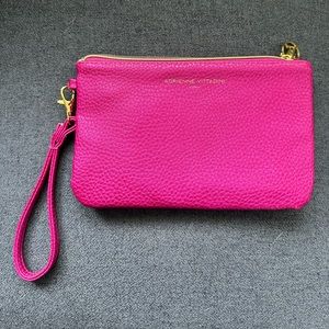 Adrienne vittadini pink clutch with charger.  Never been used.